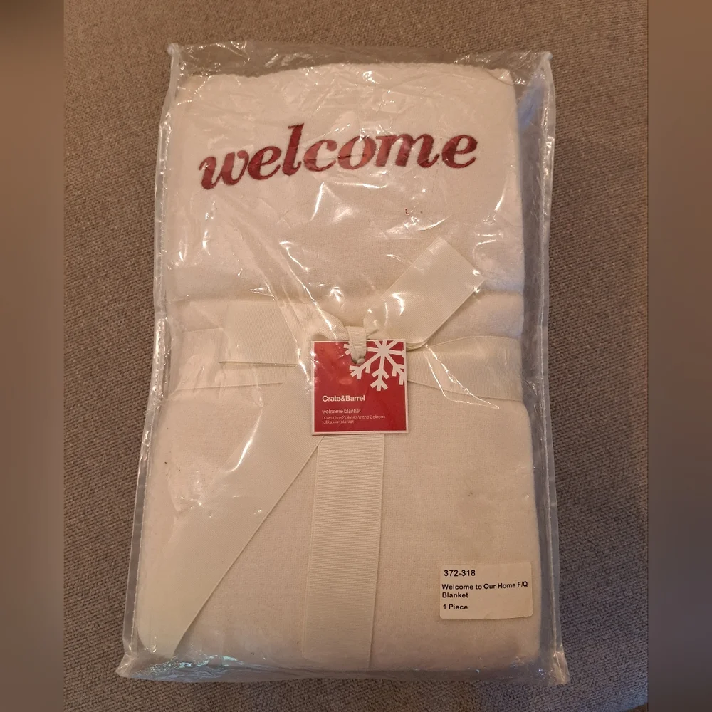 New in package. Crate & Barrel Cream Lambswool